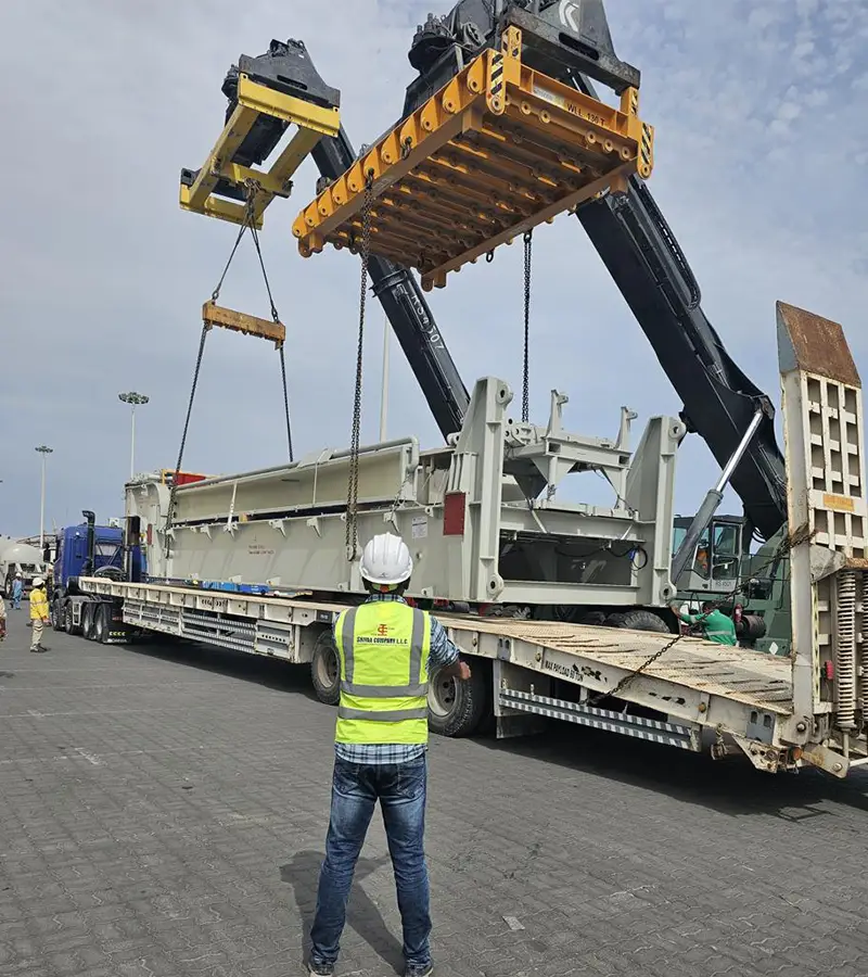 crane lifting huge materials at logistic yard